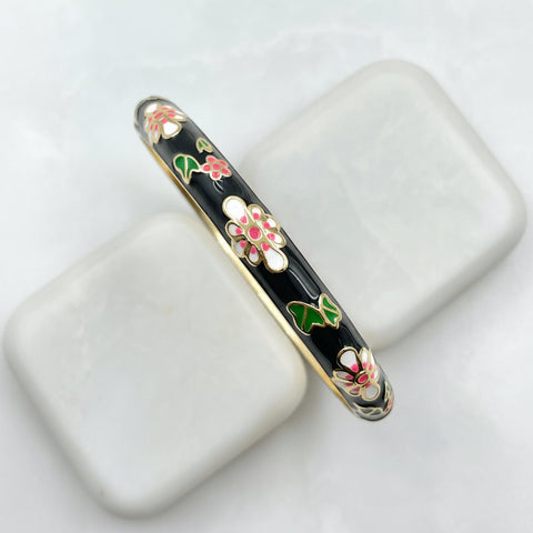 Bracciale rigido nero con dettagli fiori